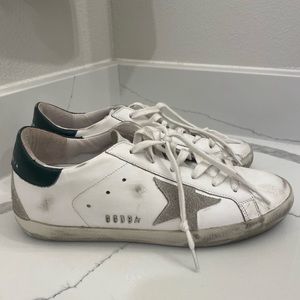 Golden Goose Super-Star Sneakers with navy heel tab and metal stud lettering